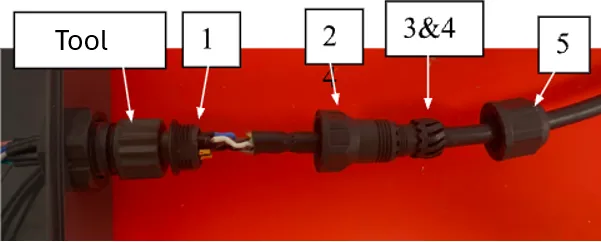 The M12 sensor plug installed onto its mating tool, labeled part 1